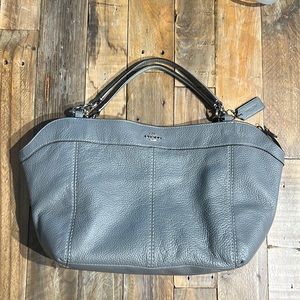 Coach gray bucket bag with one zipper pocket inside and one pouch pocket